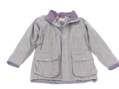 A Schoffel Gor-Tex shooting coat in green herringbone tweed material, size 44 (UK).