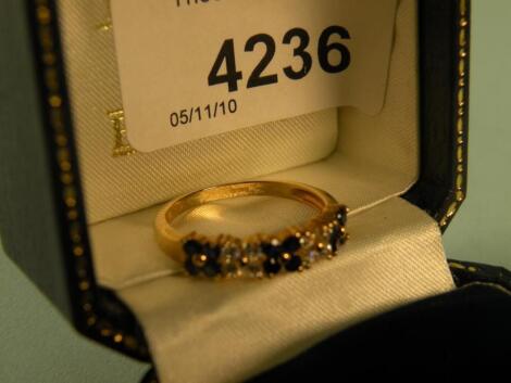 A 9 carat gold sapphire and diamond ring retailed by Brooks & Bentley