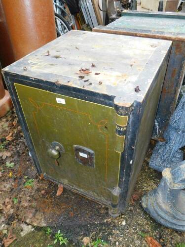 A Chatwoods of London metal safe, in army green and black, with single turn handle, with key, 71cm high, 56cm wide, 56cm deep, extra 4.5cm deep with door movement.