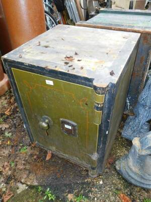 A Chatwoods of London metal safe, in army green and black, with single turn handle, with key, 71cm high, 56cm wide, 56cm deep, extra 4.5cm deep with door movement.