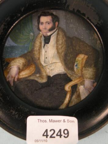 A mid 19thC miniature on ivory of a gentleman seated on a chair<br