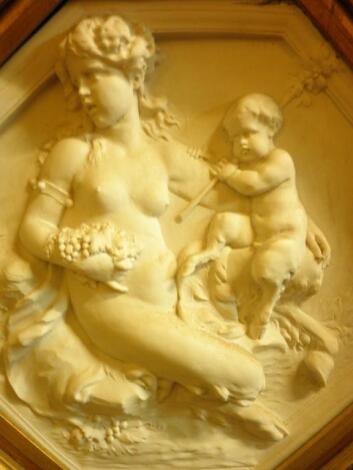 An ornate gilt framed composition plaque "Classical Maiden and