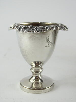 A William IV silver egg cup stand, of quatrefoil shape with recesses for spoons, scroll handle and flower and gadrooned border, housing four removable egg cups, on tapering feet, inscribed to underside "The gift of his mother to her dear son John Hodgson - 2