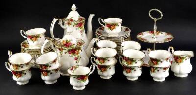 A Royal Albert Old Country Roses pattern part tea service, to include teapot, coffee pot, various cups, cake stand, etc., wear to gilding.