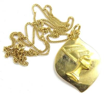 An Egyptian pendant and chain, the leaf design pendant set with Egyptian head, yellow metal, the ring stamped 750, on a fine link chain, yellow metal, stamped 750, 60cm long overall, 11.7g all in.