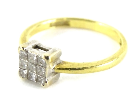 A diamond set dress ring, with square design central diamond set with nine square cut diamond stones, in a platinum setting, yellow metal stamped 19KT, ring size A½, 2.4g all in.