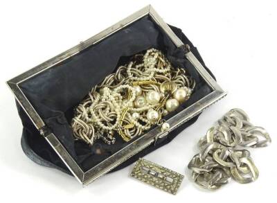 Various modern costume jewellery, to include a faux pearl necklace, gilt metal chains, etc., 86.5g all in, enclosed in a black evening purse, together with a modern silver necklace of multi link form, paste stone set brooch, etc.