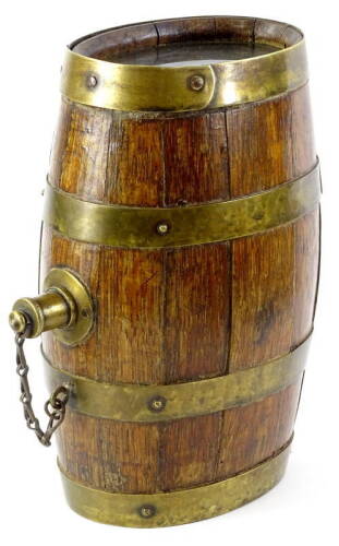 An oak and brass coopered spirit barrel, with top and glass inserts to each end.