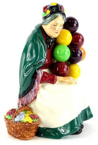 A Royal Doulton porcelain figurine, The Old Balloon Seller, HN1315, 19cm high.