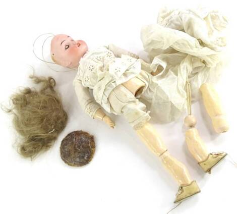 A Simon & Halbig bisque headed doll, the reverse stamped 909, 0 Germany, with composition limbs etc. (AF).