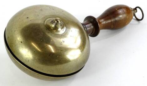 A brass and turned wooden muffin shaped hand bell, possibly American, 28cm long.