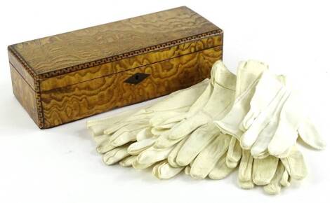 A late 19thC Hungarian ash and parquetry glove box, the hinged lid enclosing various pairs of gloves, 28cm wide.