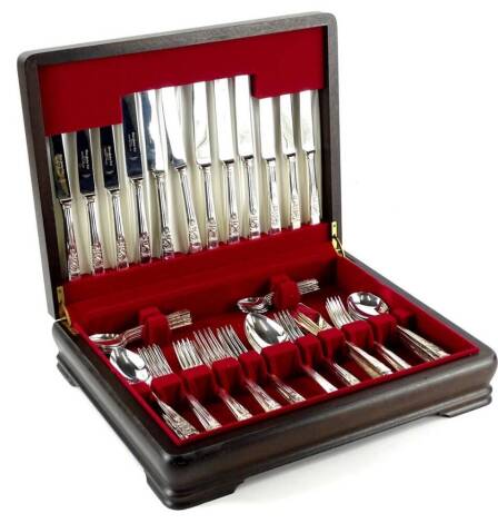 A canteen of Springtime pattern silver plated cutlery, the blades stamped Eden Parker Limited, in hardwood case.