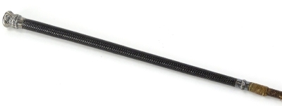 A part woven leather riding crop, with white coloured metal mounts, unmarked, 75cm long.