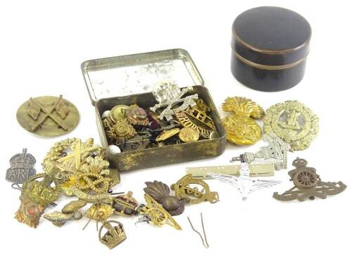 A collection of English and continental cap and other military badges, to include the Kimberley Scots, the Shropshire Regiment, the North Staffordshire Regiment, a silver ARP badge, etc.