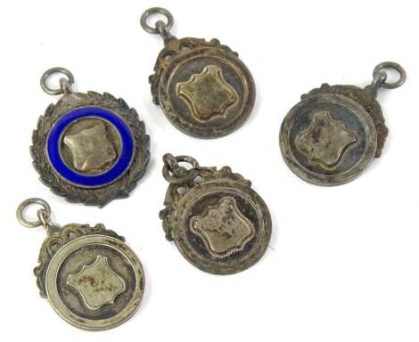 A collection of five athletics fobs, awarded for Stockport Secondary School, engraved to the reverse.