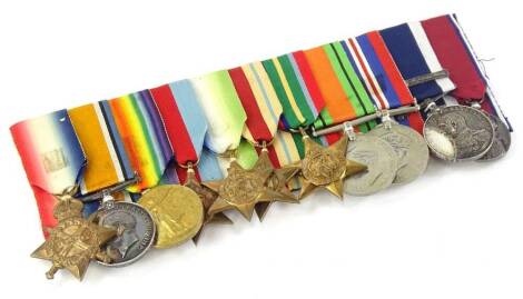 An eleven medal group relating to two reigns, awarded to an M. 7458 T.A. Houghton L.C.K.M.T.E., to include 1914-15 Star, the Defence medal, the Campaign medal, the 1939-45 Star, the Atlantic Star, the African Star, the Pacific Star, Defence medal, the Cam