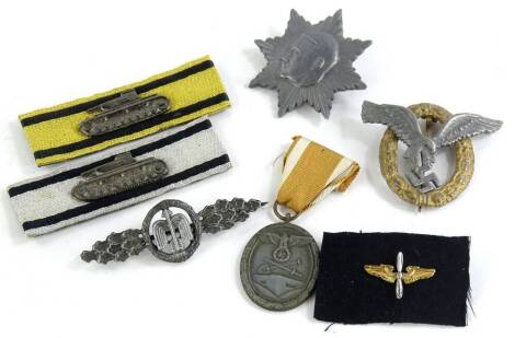 A collection of Third Reich and Third Reich Style badges, to include a German West Wall, medal etc.