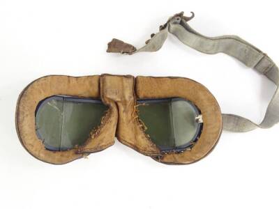 A pair of flying goggles, grey painted onto a brass, with leather coated padding, glass (AF). - 3