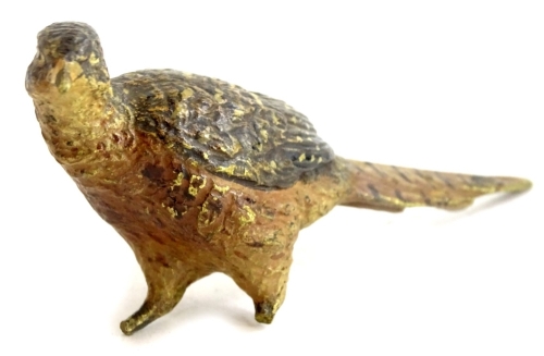 An early 20thC bronze model of a pheasant, in the manner of Bergman, (AF), 12cm long.