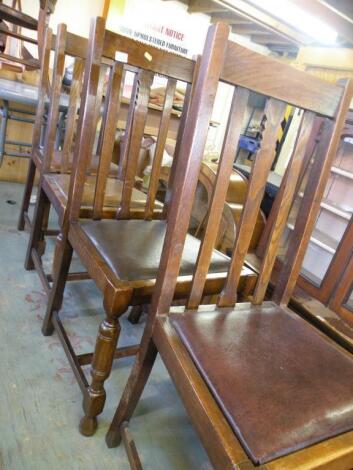 A set of four oak rail back dining chairs