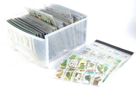 A large quantity of cigarette cards and trade cards, to include Senior Service players, Grandee etc.