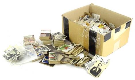 A large quantity of cigarette cards and trade cards etc.