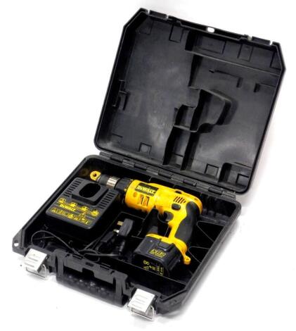 A Dewalt cordless electric drill, in fitted case.