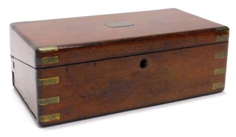 A mahogany and brass bound writing box, the rectangular brass tablet to the top bearing the name H T Cook, 49cm wide.