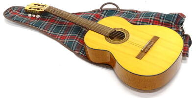 A Musima Classic acoustic guitar, made in the German Democratic Republic, 103cm high.