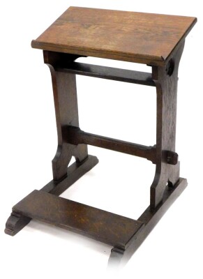 A late 19th/early 20thC oak church kneeler, with a slope top, on end supports with rectangular platform, 56cm wide.