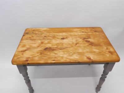 A pine kitchen table, with a rectangular top on a grey painted base with turned legs 72cm high, top 66cm x 107cm. - 2