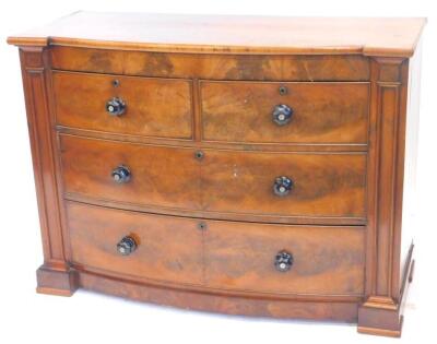 A Victorian mahogany bow fronted chest of drawers, with two short and two long drawers, each with ebonised and mother of pearl inlaid handles, flanked by pilasters, on block feet, adapted, 85cm high, 120cm wide, 52cm deep.