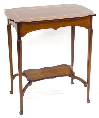 An Edwardian mahogany and chequer banded occasional table, the square top with a shaped edge on slender turned tapering legs with under tier, 61cm wide.