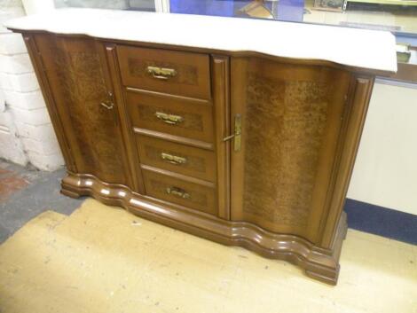 A Continental walnut and burr walnut veneered sideboard with