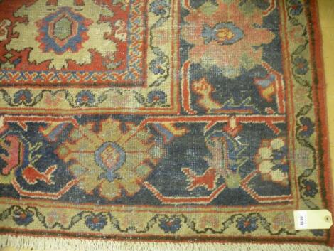 A Heriz type carpet, circa 1920 - very worn