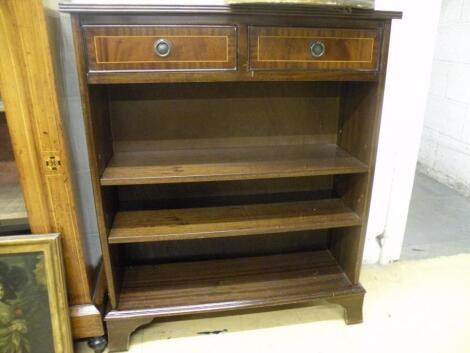 A reproduction mahogany bookcase with two frieze drawers