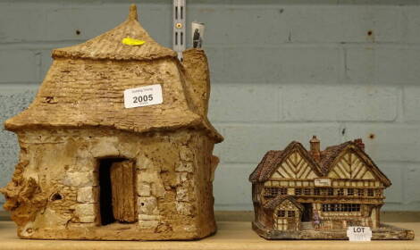 A Glebe pottery of Fulham cottage, the Falcon Inn by Madeline Raper, 15cm W, and a French pottery cottage. (2)