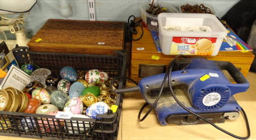 An eastern carved treen lidded box, various keys, a quantity of Franklin Mint Collector's Treasury of Eggs, a belt sander, etc. (a quantity)