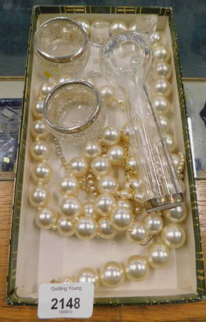 A pair of salts with silver collars, faux pearl necklaces, etc. (1 box).