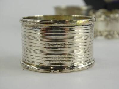 A collection of six various silver napkin rings, of differing design and date, 4¾oz, one cased. - 2