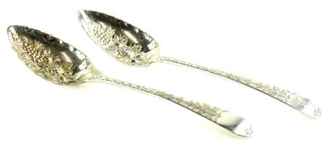 A pair of George III Scottish Old English pattern tablespoons, each later engraved and embossed with scrolls, leaves, berries, etc., Edinburgh 1823, 3½oz.