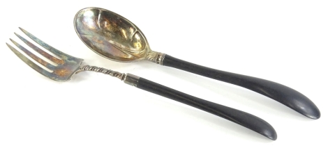 A pair of Gorham American silver plated salad servers, each with an ebonised handle, stamped Gorham, 28cm long.