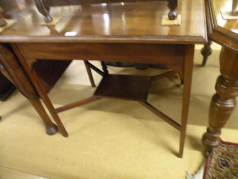 An Edwardian rectangular walnut two tier table