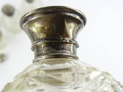 A collection of cut glass and silver mounted scent bottles, to include three globular examples, three jars, etc., to include two lids. - 2