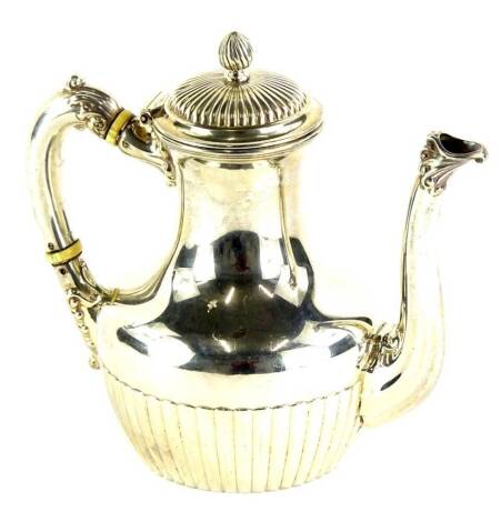 A Victorian silver part fluted teapot, with fluted decoration to the hinged lid and flame finial, shaped handle with ivory insulators, stamped to underside Sterling 2 Pints, Birmingham 1839, 19oz all in.