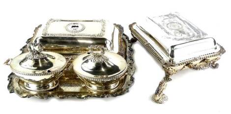 Various silver plated ware, a matched pair of early 20thC entree dishes, each with a gadrooned outline, rococo shaped scroll handles, decorative lids, two sauce tureens and a shaped dish with scroll outline, 35cm wide (a quantity).