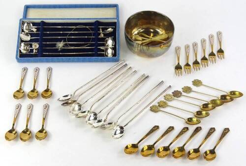 A collection of Eastern silver coloured metal etc., to include a hammered bowl stamped to underside 100 per cent, various spoons with simulated bamboo handles, etc.