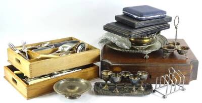 A quantity of silver plated items, to include a salver, engraved waiter, coaster, cutlery boxes, snuffer tray, egg cups and various plated cutlery.