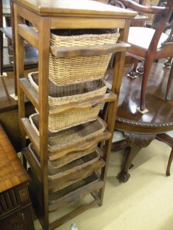 A tapering vegetable rack with five baskets